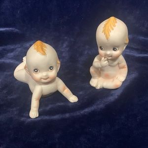 Vintage kewpie baby figures crawling and sitting